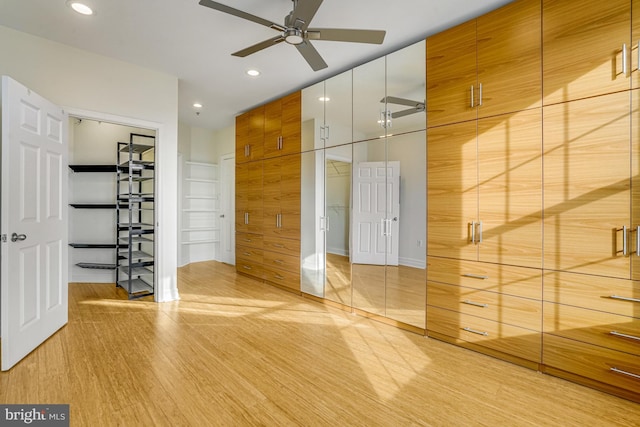 interior space with a ceiling fan, light wood-type flooring, and recessed lighting