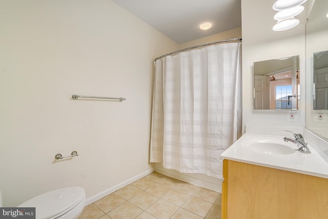 full bathroom with baseboards, toilet, tile patterned floors, shower / bath combination with curtain, and vanity