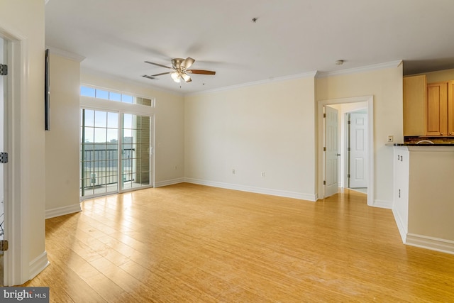 unfurnished living room featuring crown molding, visible vents, ceiling fan, light wood-type flooring, and baseboards