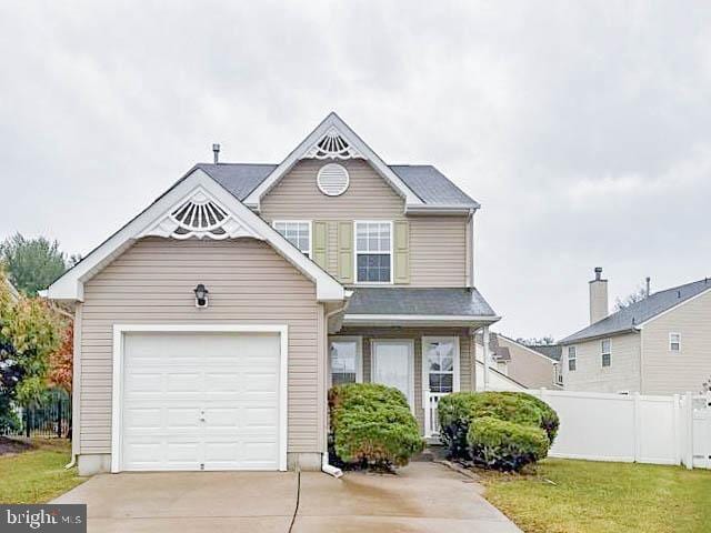 view of front of home with a garage and a front yard