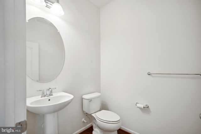 bathroom with toilet and sink