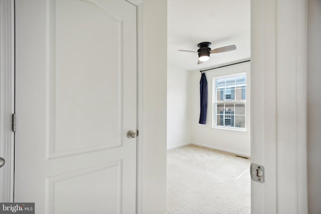 interior space featuring light colored carpet