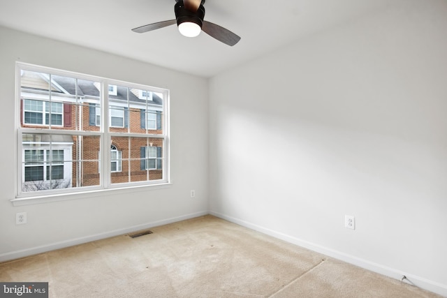 carpeted empty room with ceiling fan