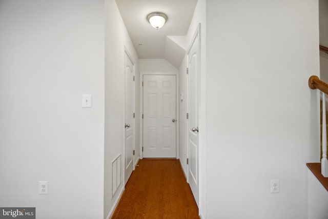 hallway with dark hardwood / wood-style floors