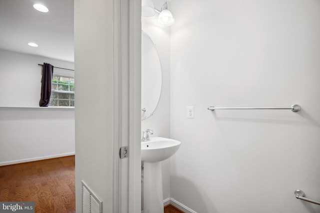 bathroom featuring wood-type flooring