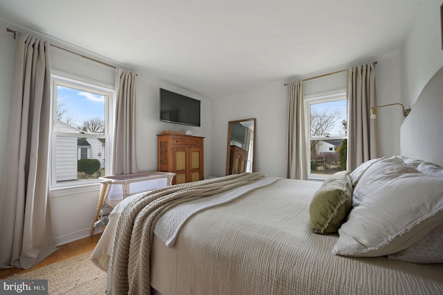 bedroom with light hardwood / wood-style flooring