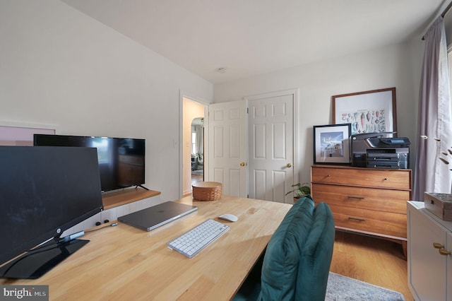 office with light hardwood / wood-style floors