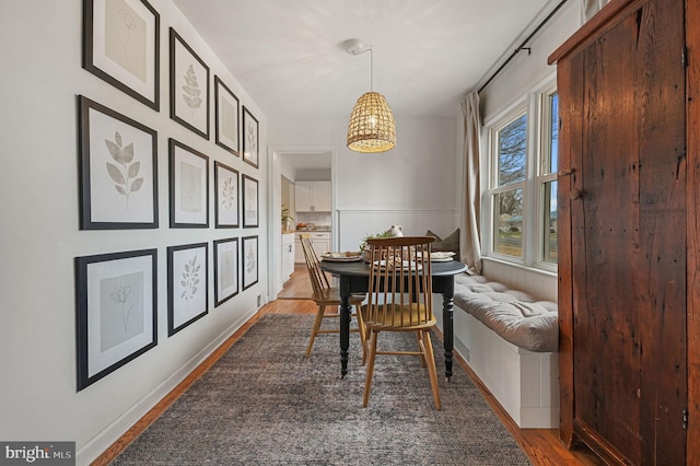 dining area with plenty of natural light and wood-type flooring