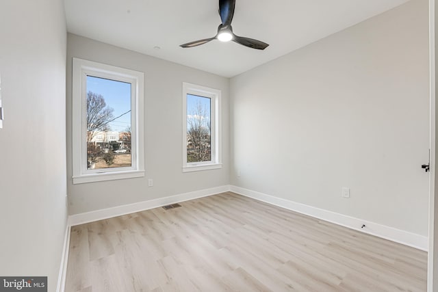 unfurnished room with ceiling fan and light wood-type flooring