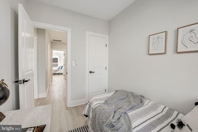 bedroom with light wood-type flooring