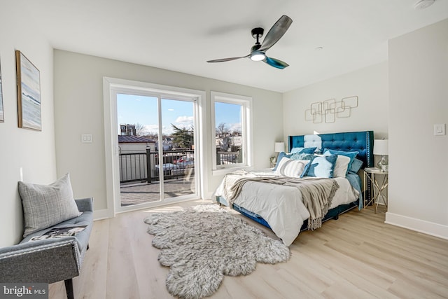 bedroom with wood-type flooring, access to outside, and ceiling fan