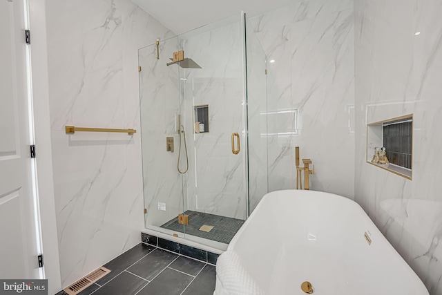 bathroom with tile patterned flooring and plus walk in shower