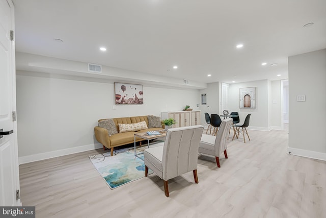 living room with light hardwood / wood-style flooring