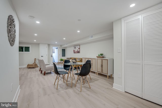 dining area with light hardwood / wood-style floors