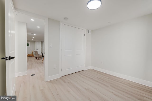 unfurnished room with light hardwood / wood-style flooring