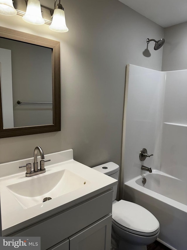 full bathroom with vanity, toilet, and bathing tub / shower combination