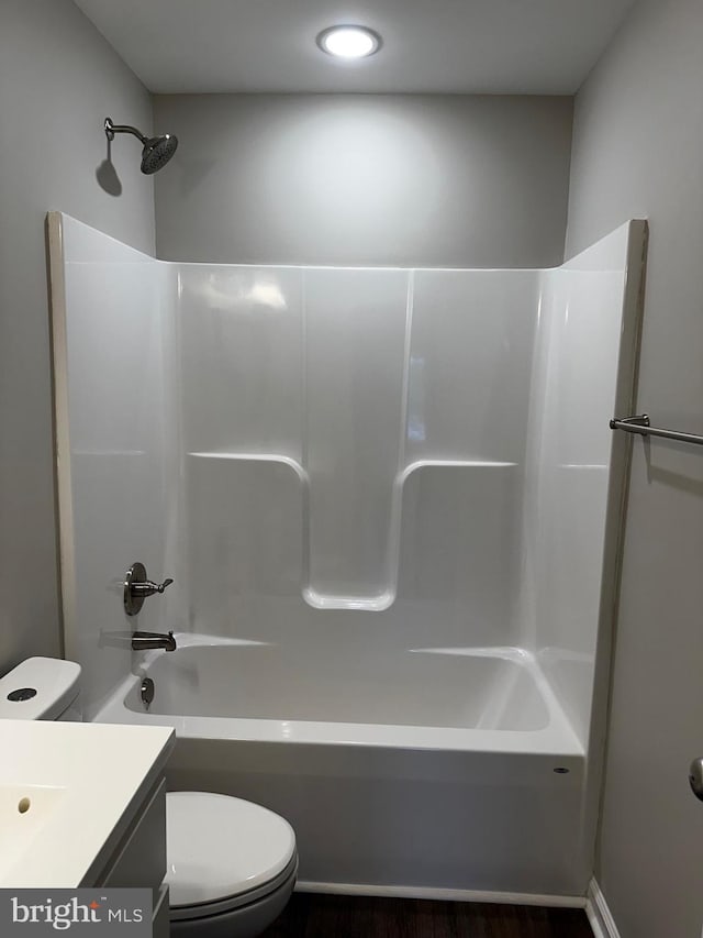 full bathroom with vanity, shower / bath combination, and toilet