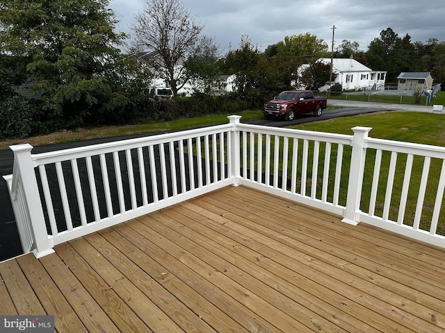 deck featuring a lawn