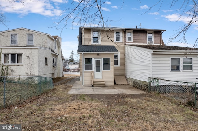 rear view of house featuring a patio