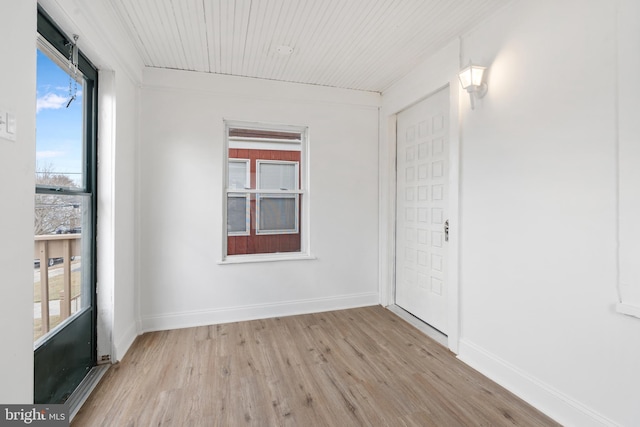 spare room with light hardwood / wood-style floors