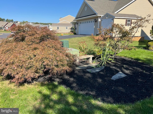 view of yard featuring a garage