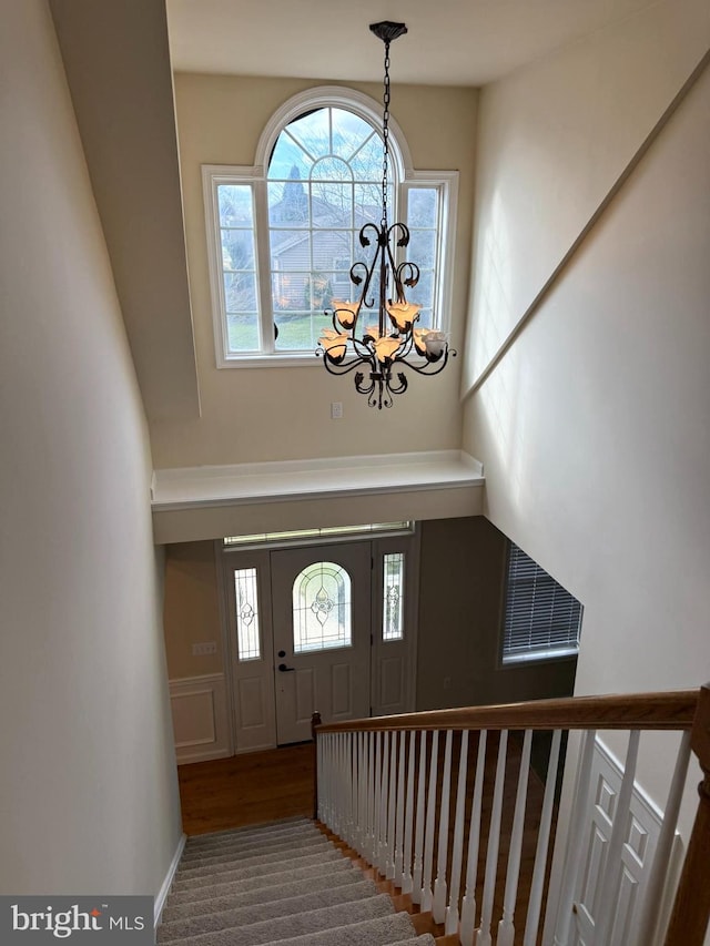 foyer featuring a notable chandelier