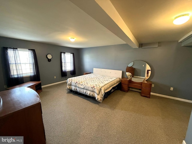 carpeted bedroom with beamed ceiling