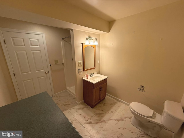 bathroom with vanity, toilet, and walk in shower