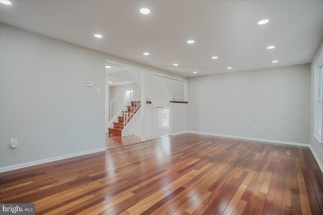 unfurnished living room with hardwood / wood-style flooring