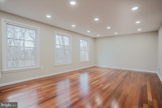 spare room featuring hardwood / wood-style flooring