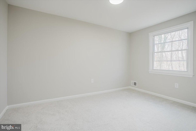 unfurnished room featuring carpet floors