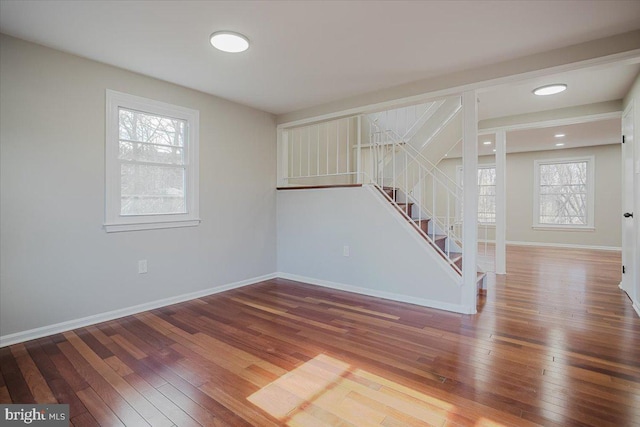 unfurnished living room with wood-type flooring