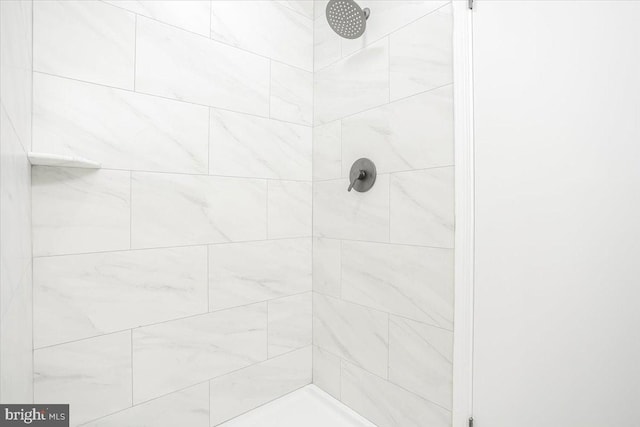 bathroom with tiled shower