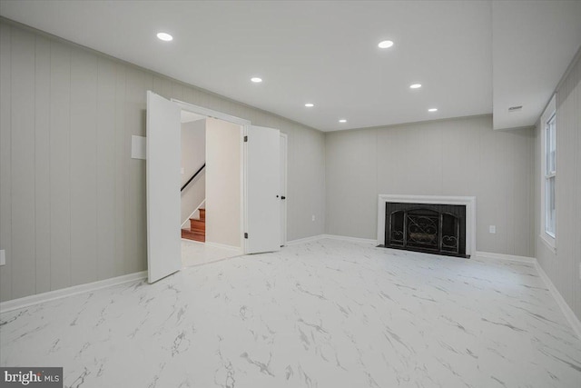 basement featuring wood walls