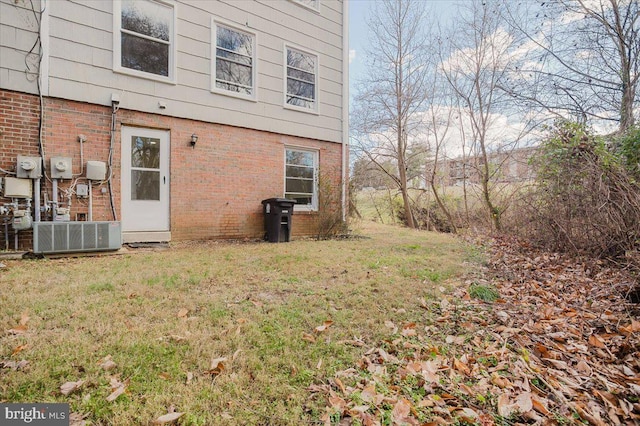 exterior space with a yard and central AC unit