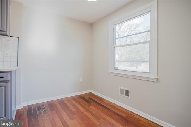 spare room featuring hardwood / wood-style flooring