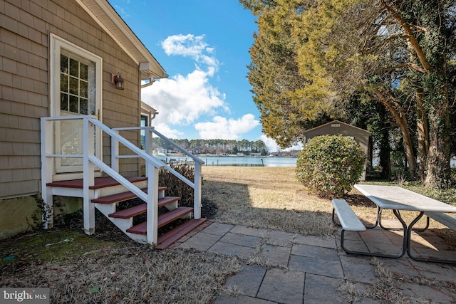 view of patio / terrace with a water view