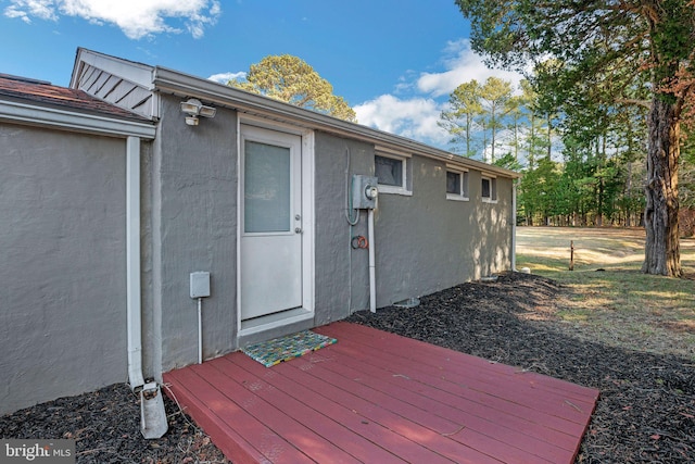 doorway to property with a wooden deck