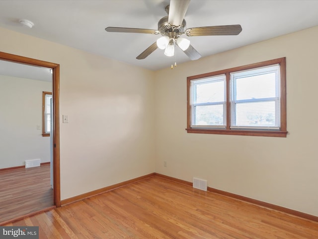 unfurnished room with light hardwood / wood-style flooring and ceiling fan