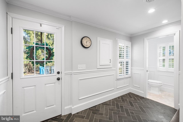 doorway featuring ornamental molding