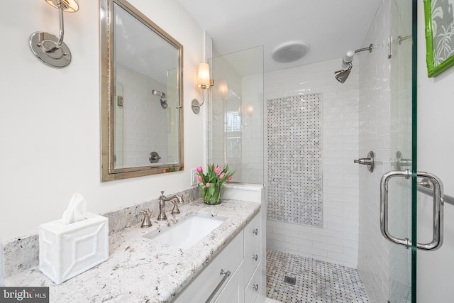 bathroom with vanity and an enclosed shower