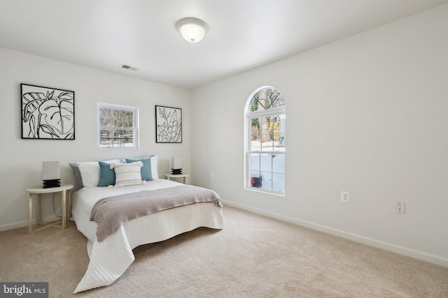 bedroom with light carpet