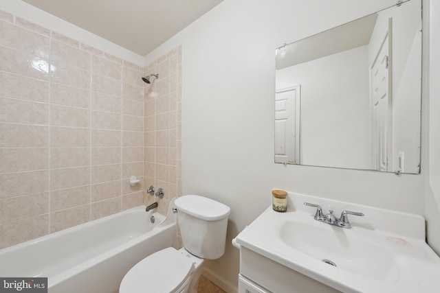 full bathroom with toilet, vanity, and tiled shower / bath