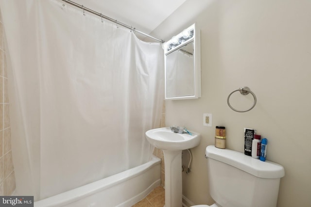 bathroom with tile patterned flooring and toilet