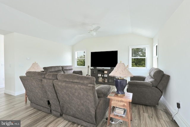 living room featuring light wood-type flooring, ceiling fan, and lofted ceiling