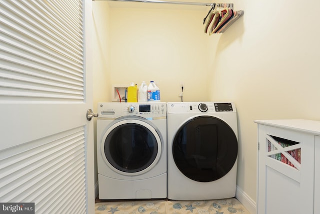 laundry room featuring washing machine and dryer