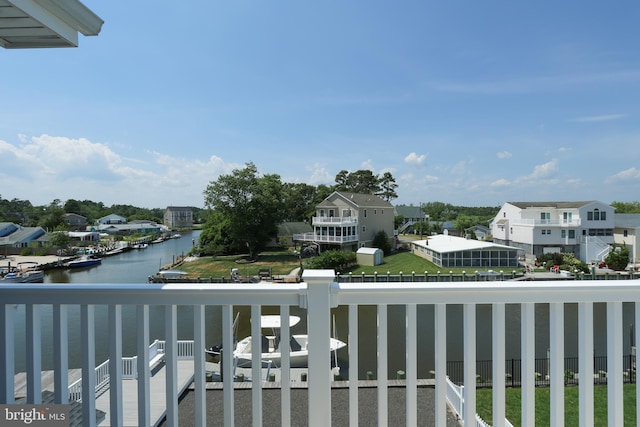 balcony featuring a water view