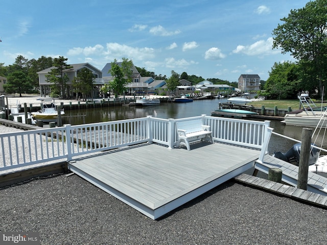 dock area featuring a deck with water view