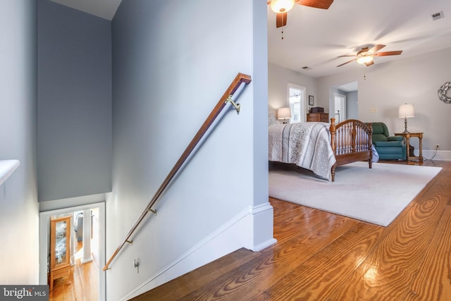 bedroom featuring hardwood / wood-style flooring and ceiling fan