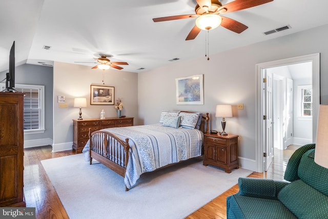 bedroom featuring ceiling fan and light hardwood / wood-style floors